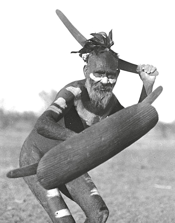 Old man holding a boomerang fotor