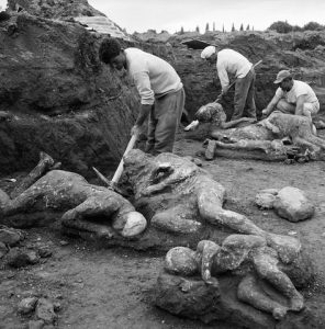 workers with casts of bodies at pompeii